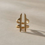 Akash Shield Statement Ring in solid recycled gold from the front, two carved bars joined by a double band.