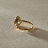 Aurum Pear Diamond Ring from the side at a low angle.