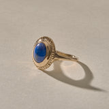 Cleo Lapis Lazuli Amulet Ring in gold at an angle, showing the lapis stone and slim band.