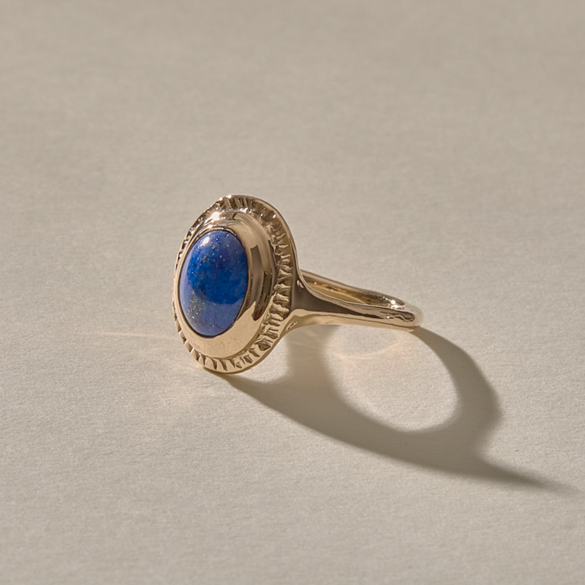 Cleo Lapis Lazuli Amulet Ring in gold at an angle, showing the lapis stone and slim band.