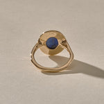 Cleo Lapis Lazuli Amulet Ring in gold from behind, showing the open back where the stone touches the skin.