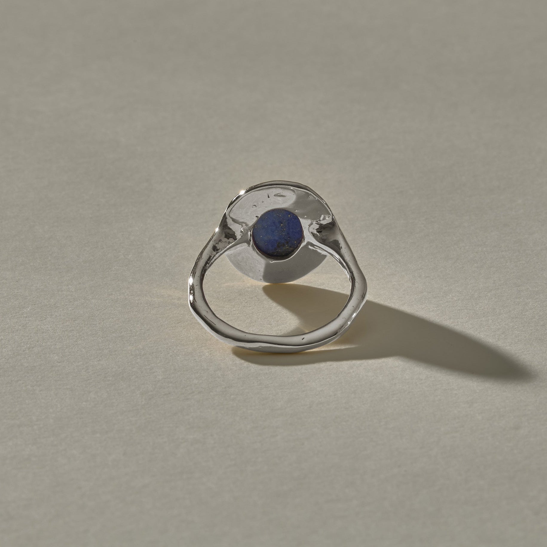 Cleo Lapis Lazuli Amulet Ring in sterling silver from behind, showing the open back setting.