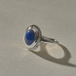 Cleo Lapis Lazuli Amulet Ring in recycled sterling silver, an oval lapis lazuli cabochon in a carved silver bezel.