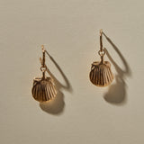 Elysian Shell Hoop Earrings in recycled bronze, cast scallop shells hanging from small hoops.