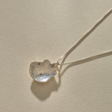 Back of the Elysian Shell Necklace pendant in sterling silver, showing the smooth inside of the shell.