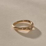Eros Five-Stone Champagne Diamond Band in solid recycled gold from the side, showing the softly undulating band.