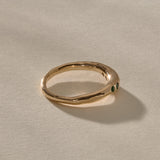 Eros Five-Stone Emerald Band in solid recycled gold from the side, showing the smooth organic band.