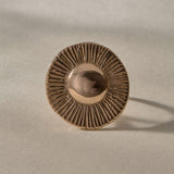 Heart of the Sun Statement Ring in recycled bronze from the front, showing the round sunburst face.