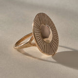 Heart of the Sun Statement Ring in recycled bronze from the side, showing the sunburst face and slim band.