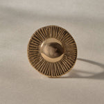 Heart of the Sun Statement Ring in solid recycled gold from the front, a domed center radiating fine carved rays.