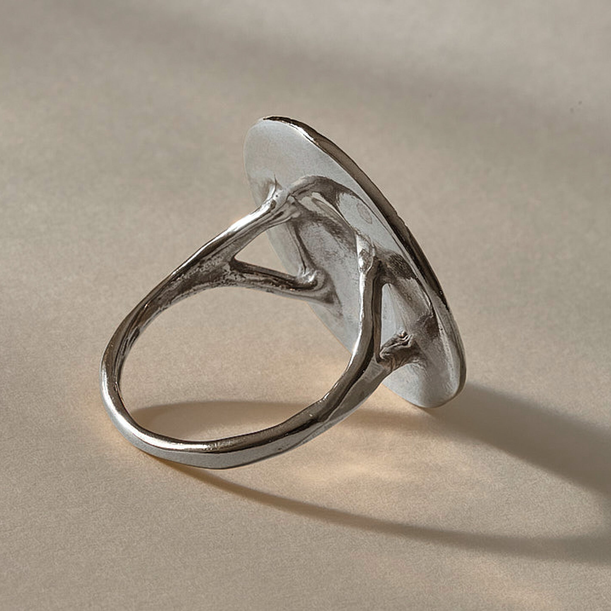 Heart of the Sun Statement Ring in recycled sterling silver from the back at an angle, showing the split shoulders of the band.