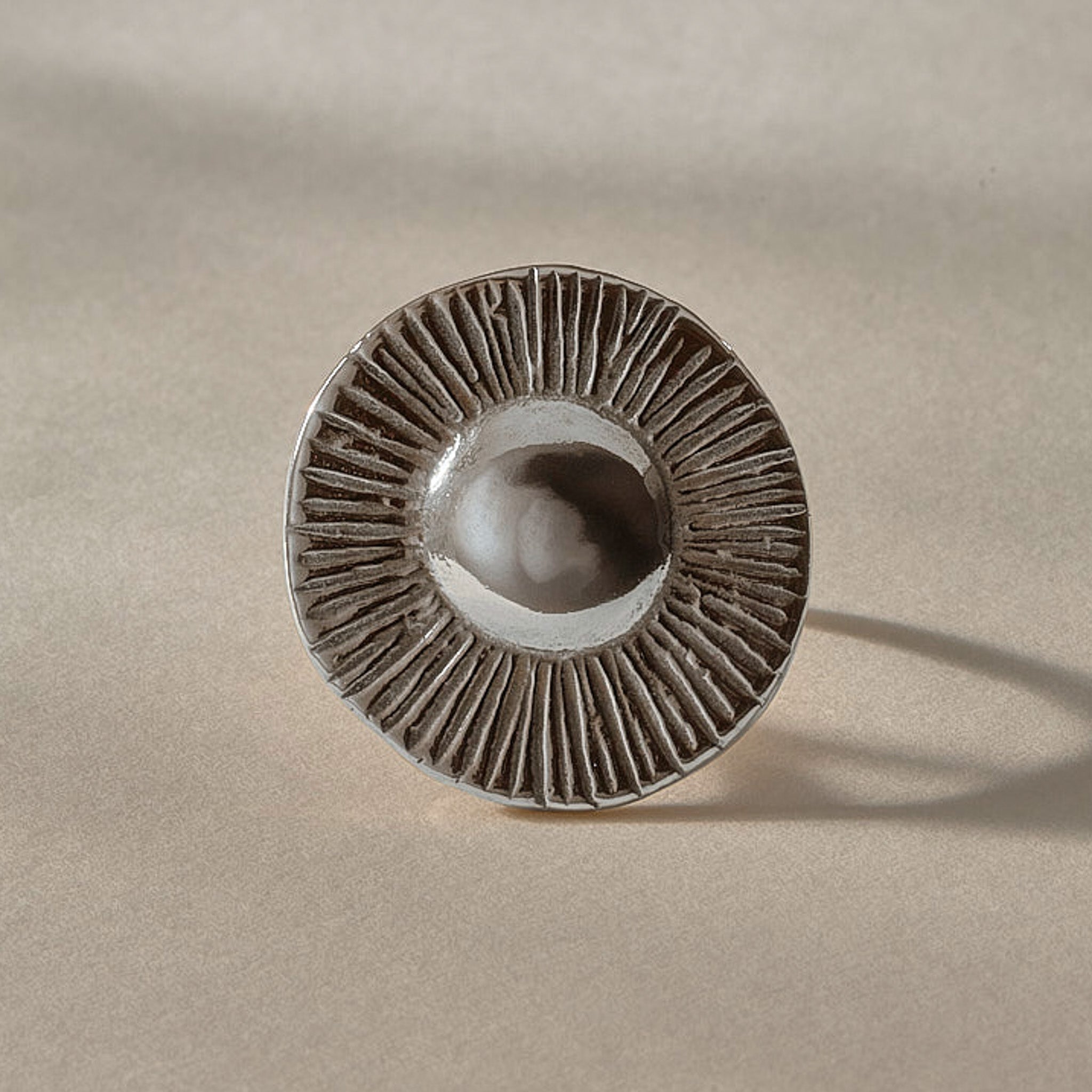 Heart of the Sun Statement Ring in recycled sterling silver from the front, showing the round sunburst face.