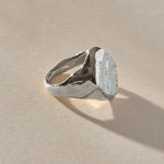 Heritage Textured Signet Ring in recycled sterling silver at an angle, showing the dappled signet face.