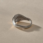Neptune Spiral Shell Ring in sterling silver from the back, showing the smooth tapered band.