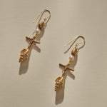 Sereia Shell and Pearl Chandelier Earrings in bronze laid side by side, showing each tier of the drop.