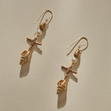 Sereia Shell and Pearl Chandelier Earrings in bronze laid side by side, showing each tier of the drop.