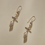 Sereia Shell and Pearl Chandelier Earrings in sterling silver laid side by side, showing each tier of the drop.