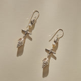 Sereia Shell and Pearl Chandelier Earrings in sterling silver laid side by side, showing each tier of the drop.