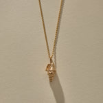 Sereia Spiral Shell Necklace in recycled bronze, a cast spiral seashell pendant on a fine rolo chain.