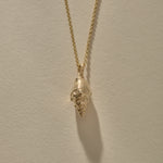 Clasp and rolo chain of the Sereia Spiral Shell Necklace in gold.