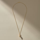 Sereia Spiral Shell Necklace in gold, a close view of the ridged spiral shell.