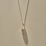 Sereia Spiral Shell Necklace in sterling silver, a close view of the ridged spiral shell.