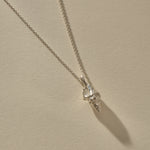 Sereia Spiral Shell Necklace in sterling silver, the spiral shell hanging from its chain.