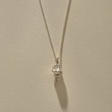 Sereia Spiral Shell Necklace in recycled sterling silver, a cast spiral seashell pendant on a fine rolo chain.