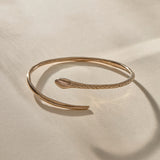 Serpent Snake Arm Cuff in recycled bronze, hand-carved with a detailed snake head and scales.