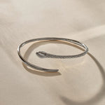 Serpent Snake Arm Cuff in recycled sterling silver, hand-carved with a detailed snake head and scales.