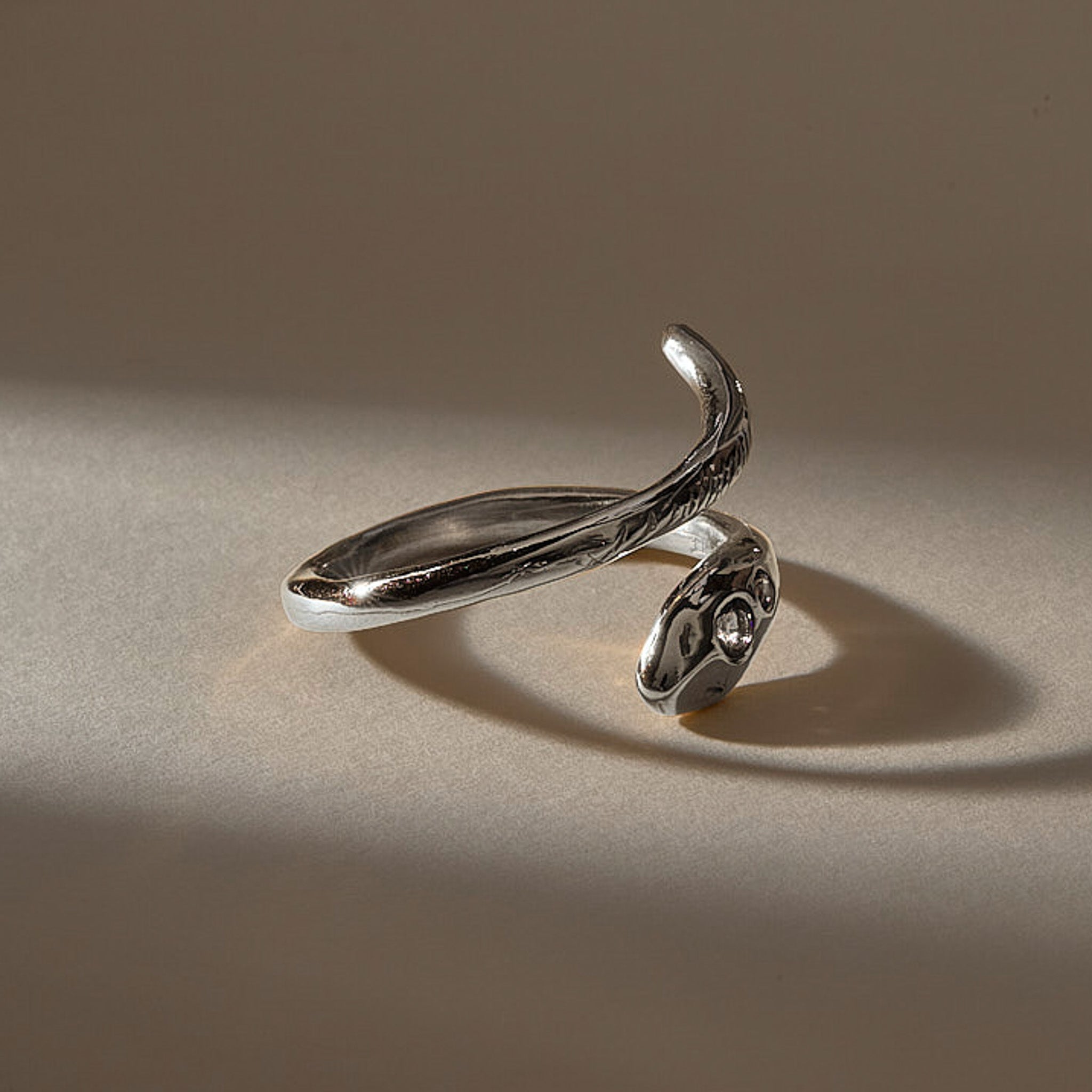 Stoned Serpent Smoky Quartz Ring in recycled sterling silver, angled view of the snake head and tail
